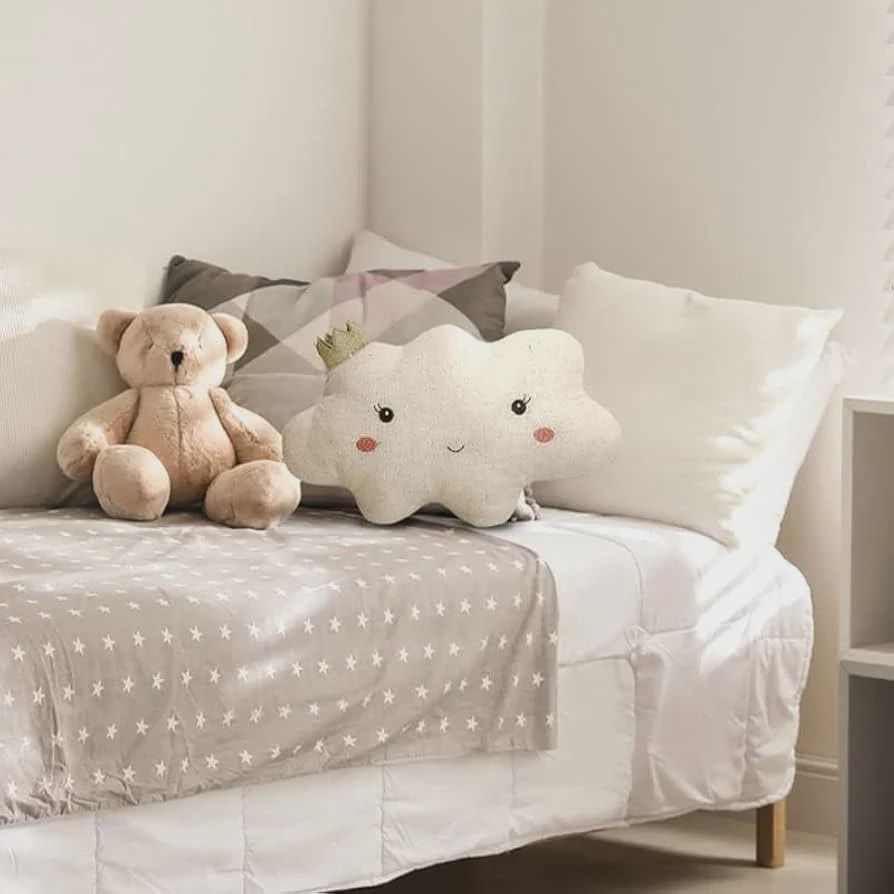The Mon Ami Reine Cloud Pillow is a soft, cozy decorative pillow designed in the shape of a fluffy cloud. Made from plush fabric, it features a serene and calming design, perfect for adding a touch of whimsy to a nursery, bedroom, or cozy space. 