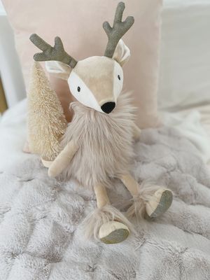 Mon Ami Ivey the Reindeer Doll is a soft, adorable plush doll designed to resemble a reindeer with a playful, holiday-inspired look. Featuring a sweet face, soft fabric, and details like antlers, a red scarf, and a cozy outfit, Ivey exudes charm and festive spirit. 