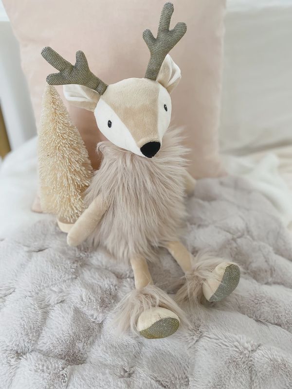 Mon Ami Ivey the Reindeer Doll is a soft, adorable plush doll designed to resemble a reindeer with a playful, holiday-inspired look. Featuring a sweet face, soft fabric, and details like antlers, a red scarf, and a cozy outfit, Ivey exudes charm and festive spirit. 