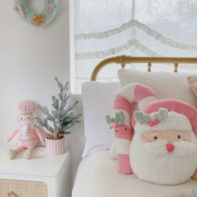 The Mon Ami Pink Santa Accent Pillow is a charming, festive decorative pillow designed to add a playful touch to holiday decor. Featuring a soft, plush fabric, the pillow showcases a whimsical Santa Claus design with a pink color scheme, giving it a modern and cheerful twist on traditional Christmas decor. 