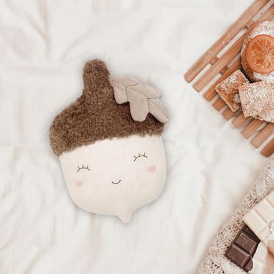 The Mon Ami Nutty Acorn Accent Decor Plush is a whimsical, seasonal plush designed to resemble an acorn, with soft, textured fabrics that give it a cozy, autumnal feel. 