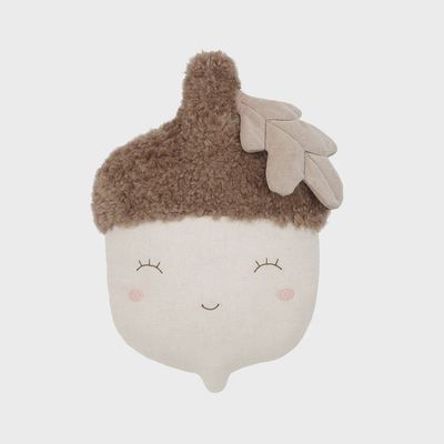 The plush typically features a detailed cap and a friendly, charming expression, adding a playful touch to fall or harvest-themed decor. 