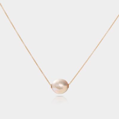 The Floating Pearl Necklace - White Cultured Pearl by Cove Fine Jewelry is a timeless and elegant piece featuring a single, lustrous white cultured pearl. 