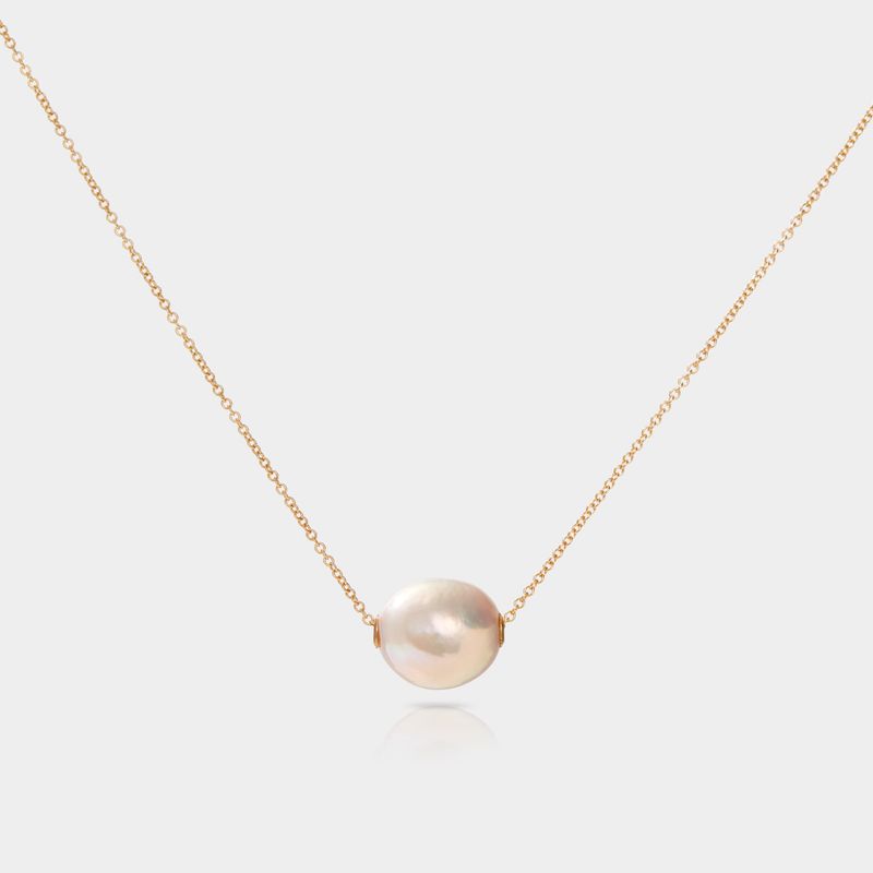 The Floating Pearl Necklace - White Cultured Pearl by Cove Fine Jewelry is a timeless and elegant piece featuring a single, lustrous white cultured pearl. 