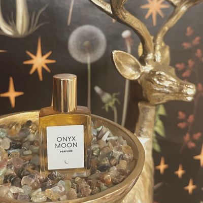 Onyx Moon Perfume Oil is a rich, deep fragrance that offers an alluring, earthy scent profile. Typically featuring notes of dark florals, spices, and warm, resinous undertones, this perfume oil exudes a sense of mystery and sophistication. The oil-based formula provides a long-lasting scent, with a smooth, moisturizing feel that is gentle on the skin. Onyx Moon Perfume Oil is ideal for those seeking a bold, luxurious fragrance that lingers subtly throughout the day or evening. Its sleek, elegant packaging adds to the overall high-end, sensual experience of the fragrance.