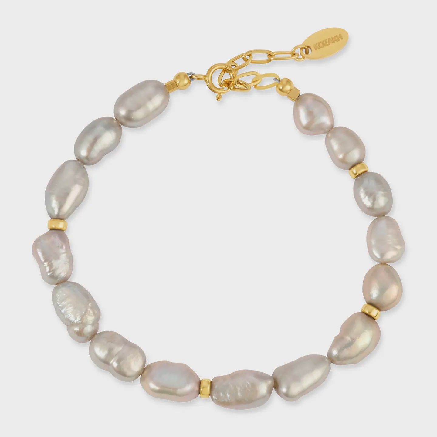 The Kozakh Grey Pearl Bracelet is a refined and elegant piece featuring smooth grey pearls, creating a subtle yet sophisticated look. 