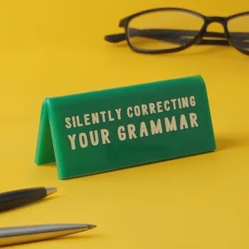 SILENTLY CORRECTING YOUR GRAMMAR SIGN