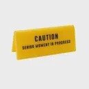 SENIOR MOMENT IN PROGRESS DESK SIGN YELLOW