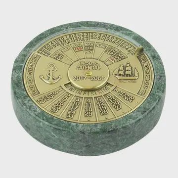 ANTIQUE BRASS 50-YEAR CALENDER ON MARBLE