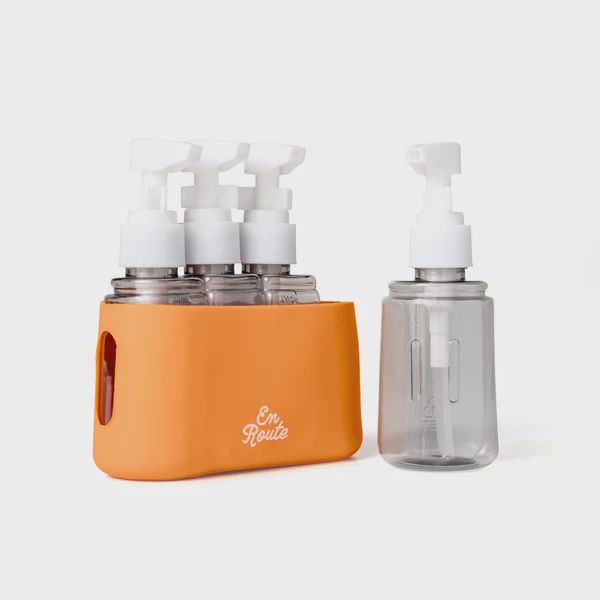 Four piece travel bottle set