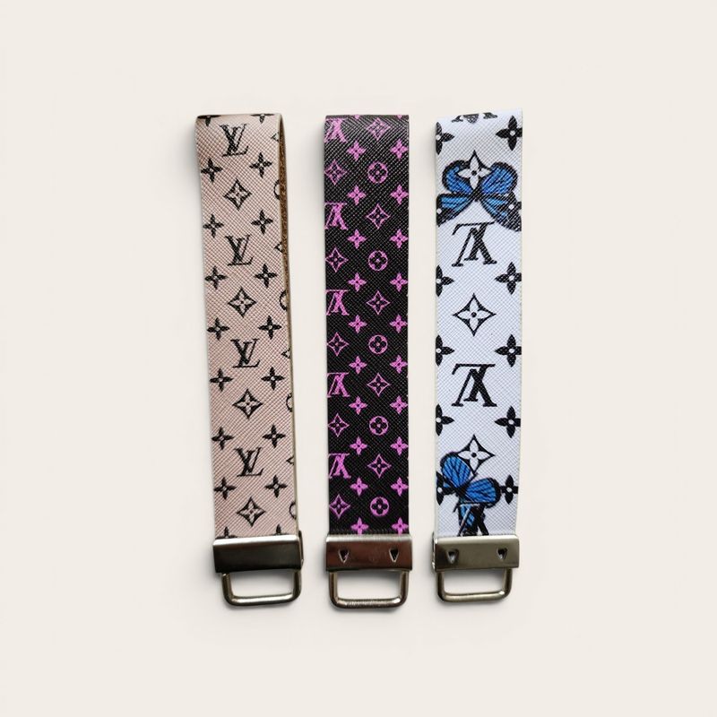 INSPIRE LV Wristlet Keychain with Pom