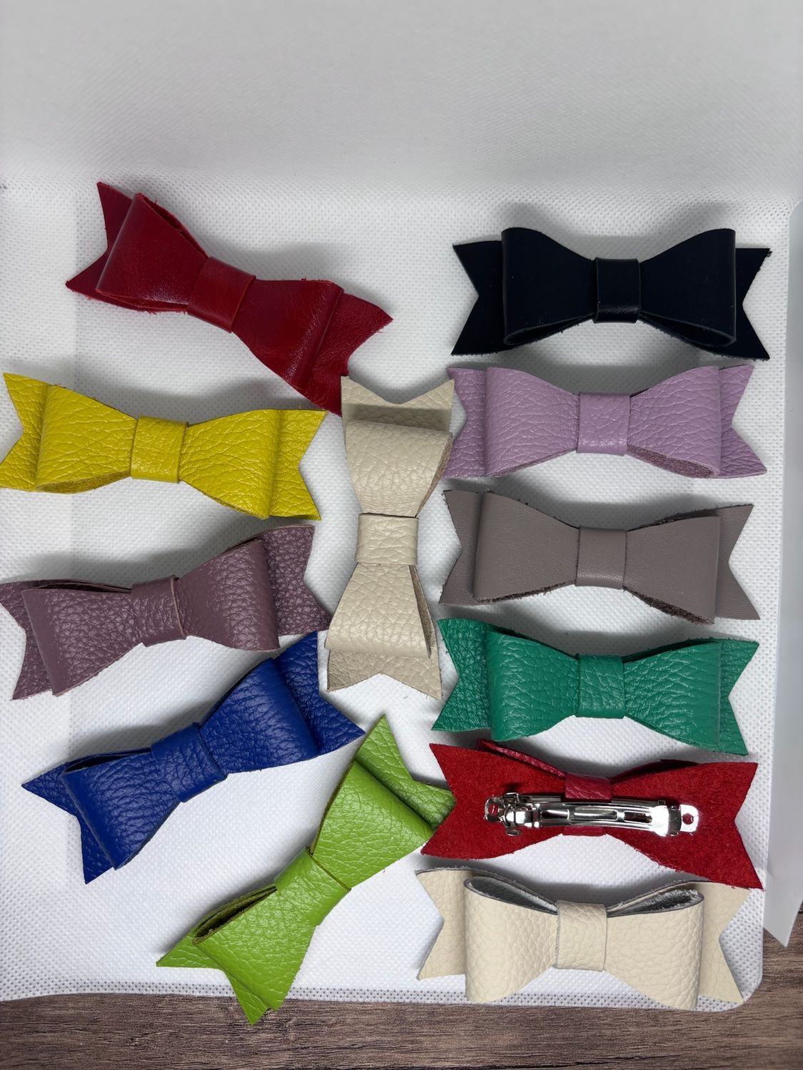 Multicolored hair clips made of genuine leather in the form of a bow