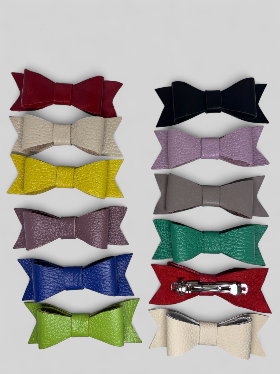Multicolored hair clips made of genuine leather in the form of a bow