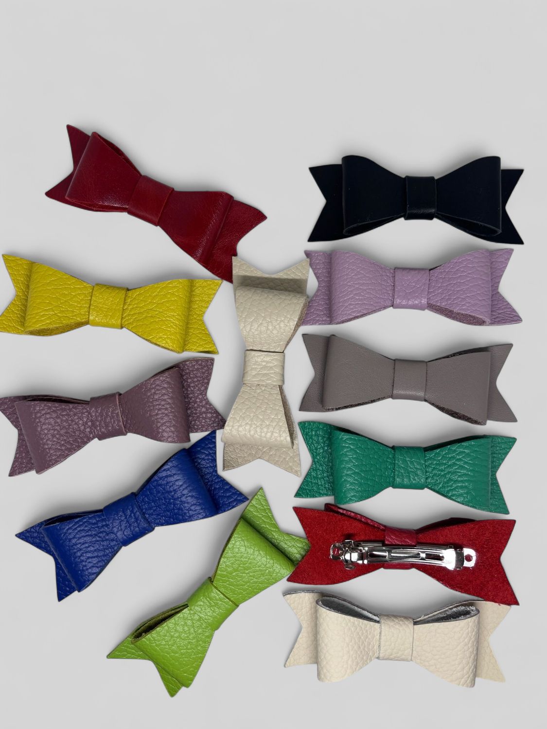 Multicolored hair clips made of genuine leather in the form of a bow