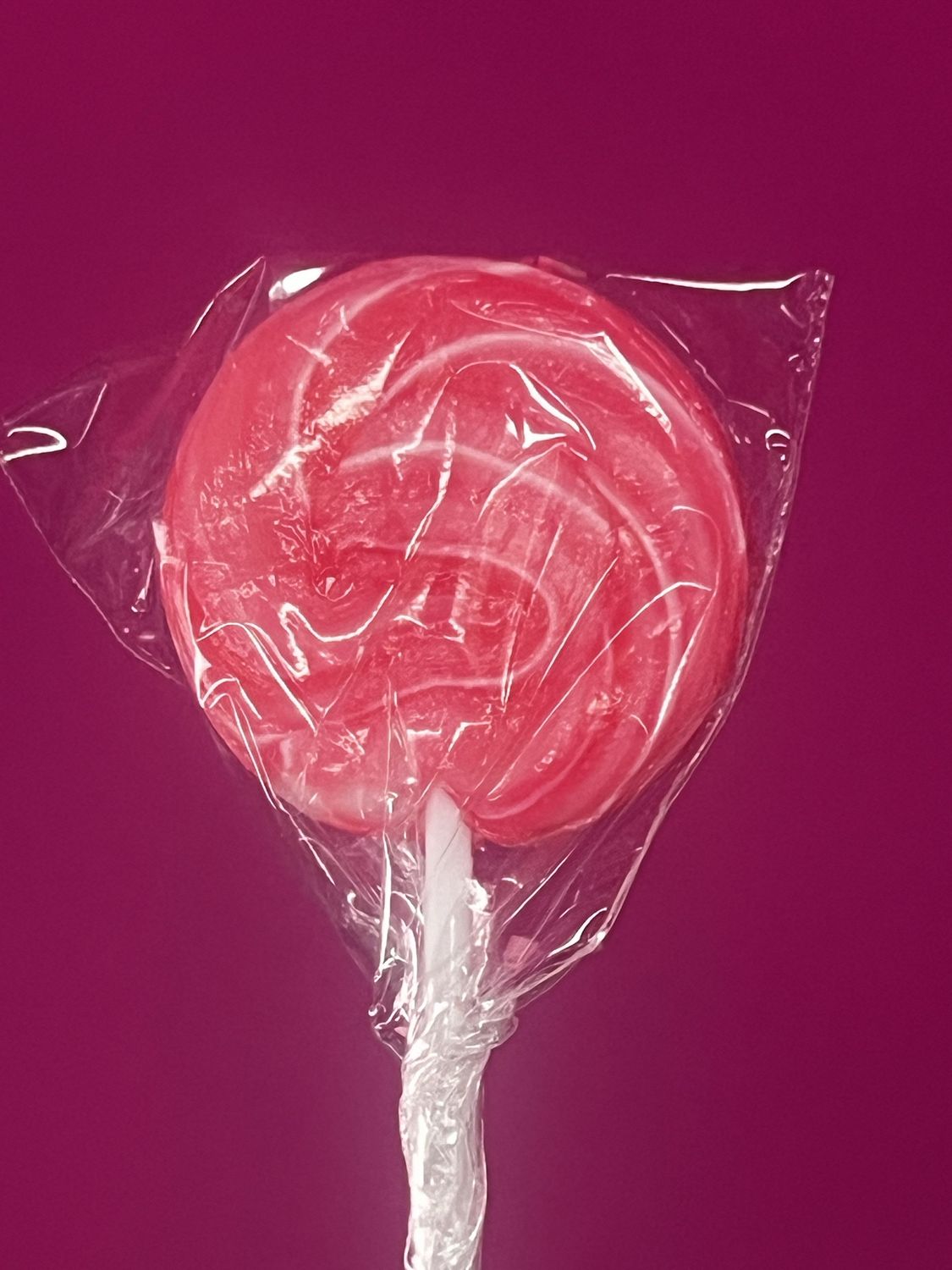 Deep pink and white swirl lollipop