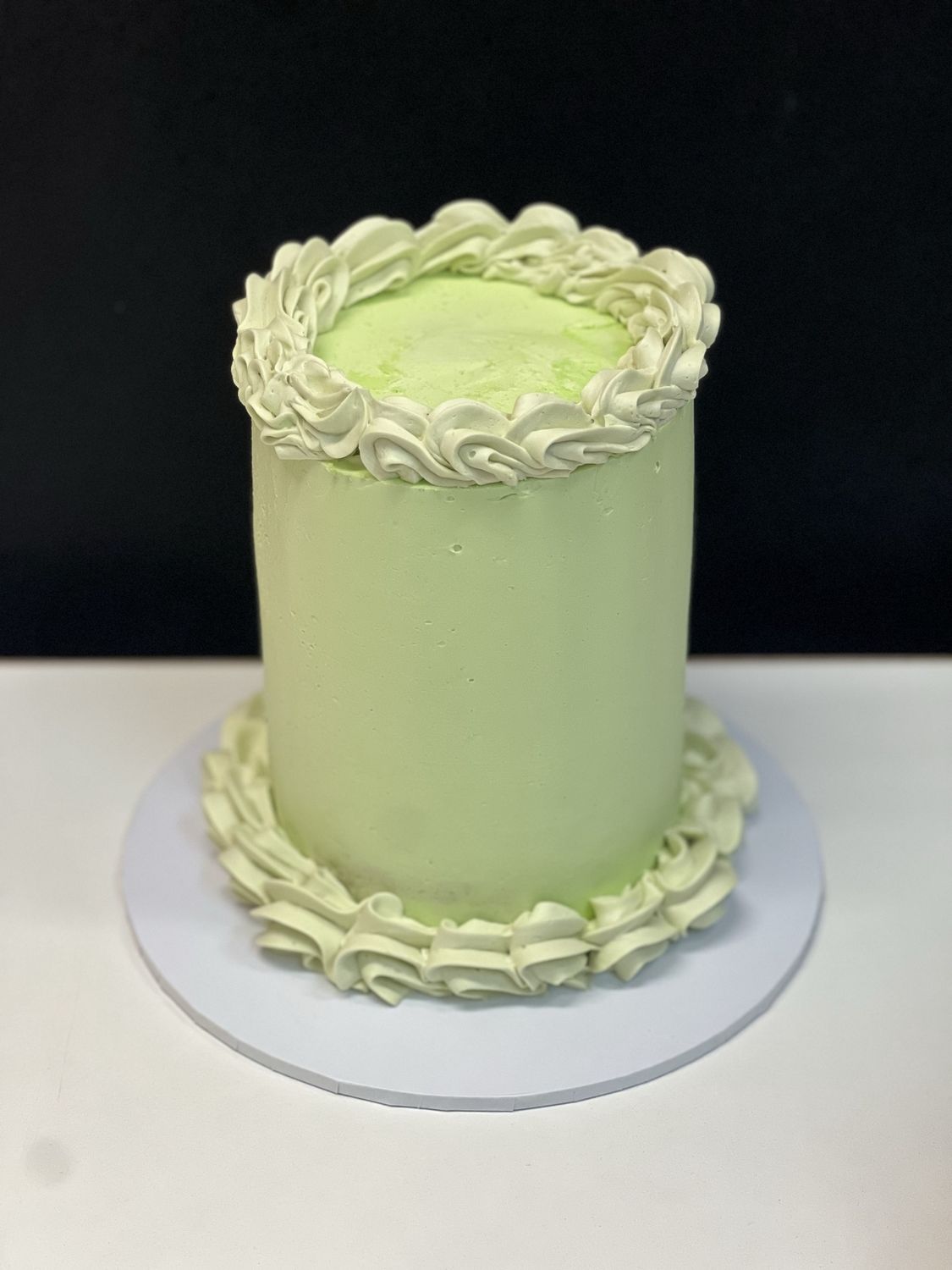 Small pastel green cake