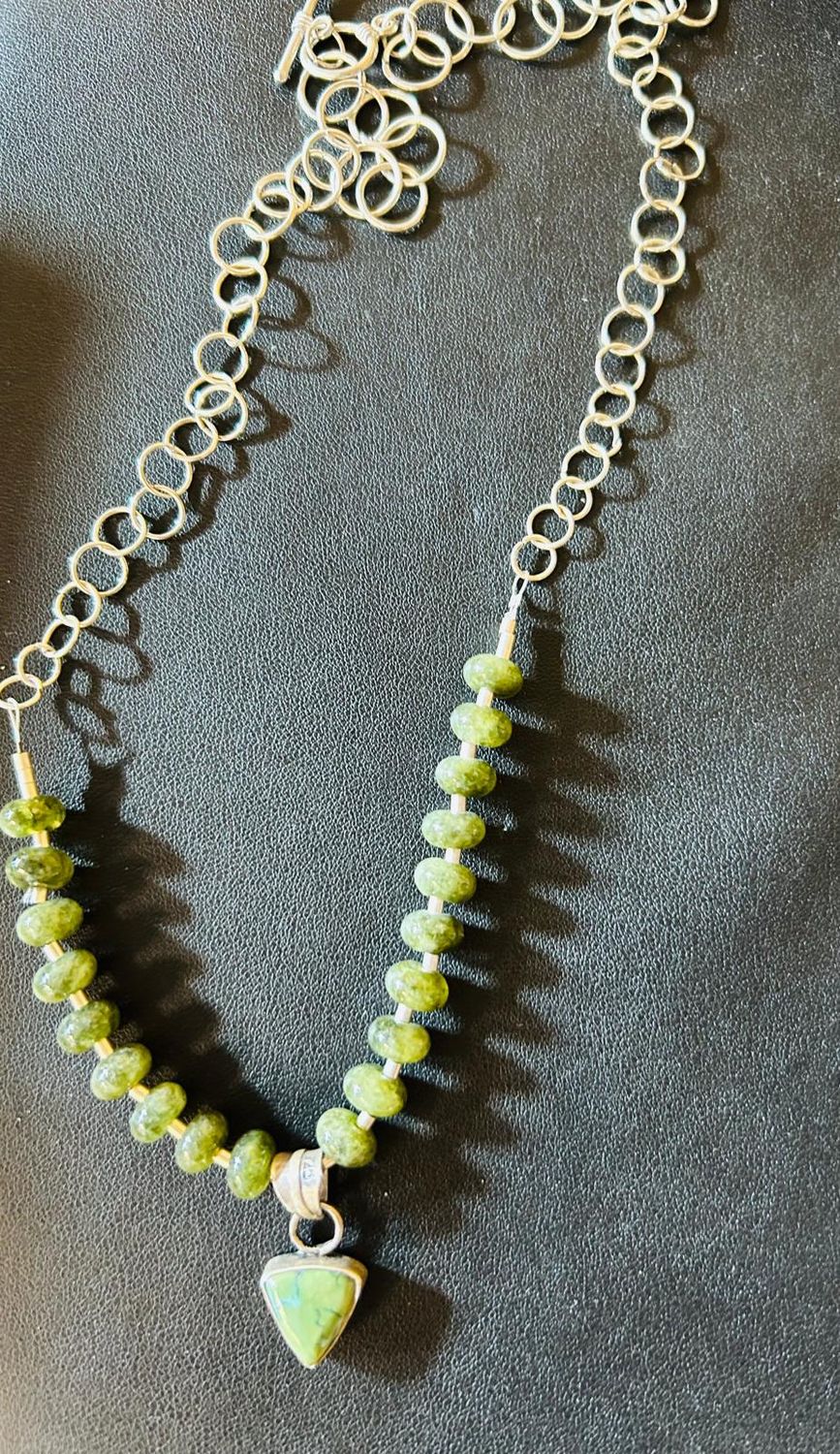 Jade beads with Sterling silver and handmade silver colored chain. 20” $145