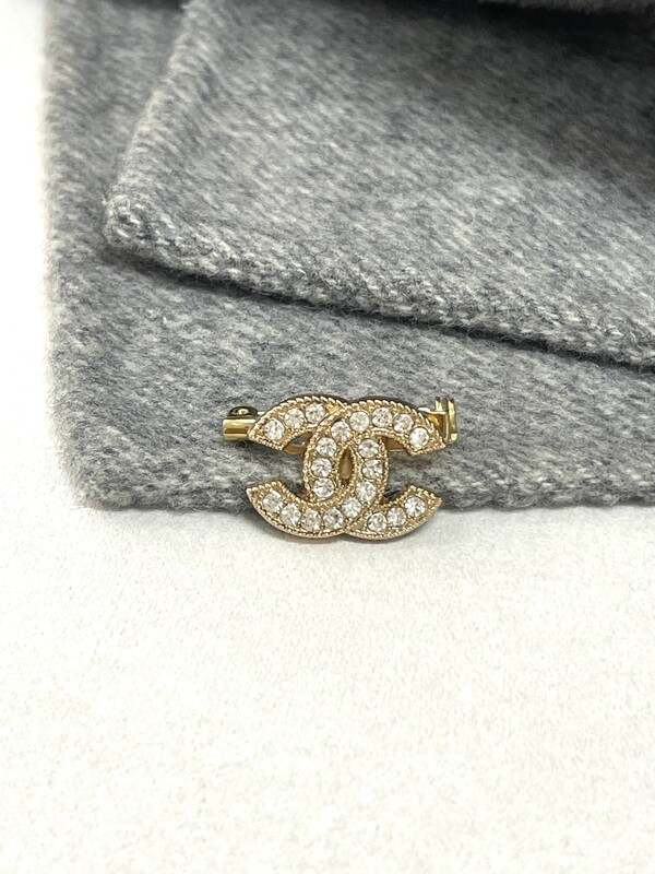 Gold with rhinestones small brooch