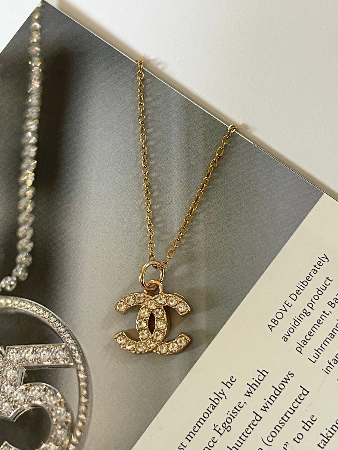 Delicate charm necklace gold tone with tiny rhinestones