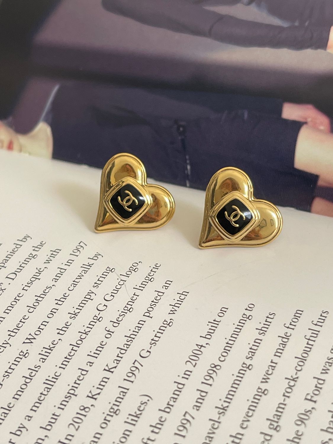 Delicate gold tone hearts with black logo