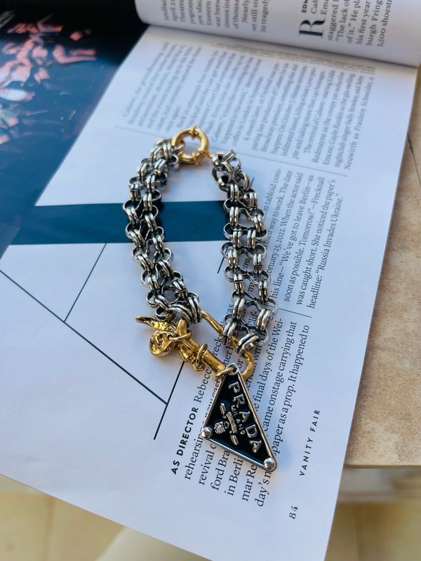 Stylish bracelet silver and old tone with triangle charm