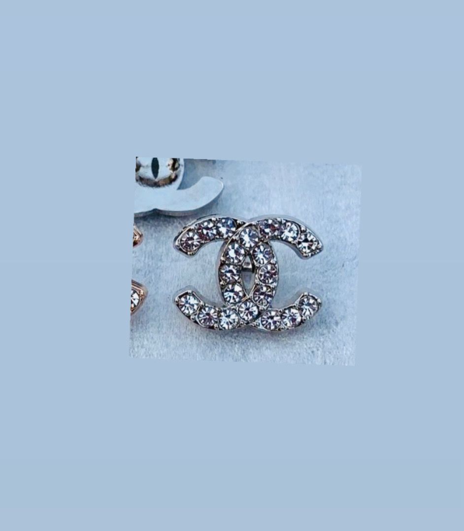 Silver tone logo Small brooch