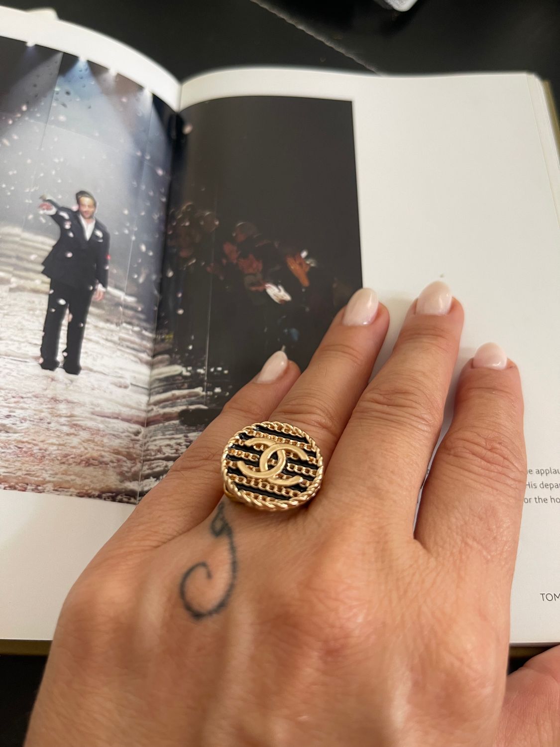 Elegant gold tone ring with button