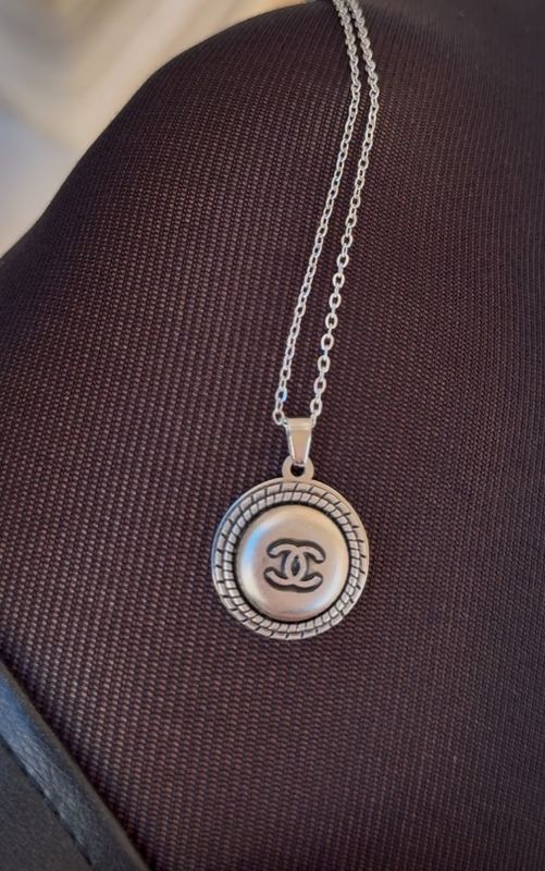 Stylish silver tone charm necklace