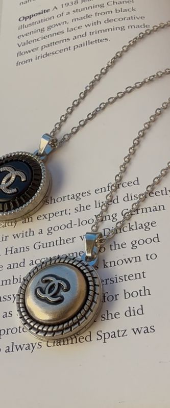 Stylish silver tone charm necklace