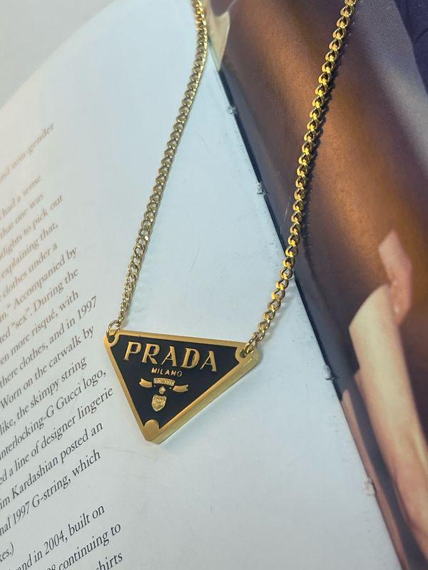 Stylish black and gold tone triangle necklace
