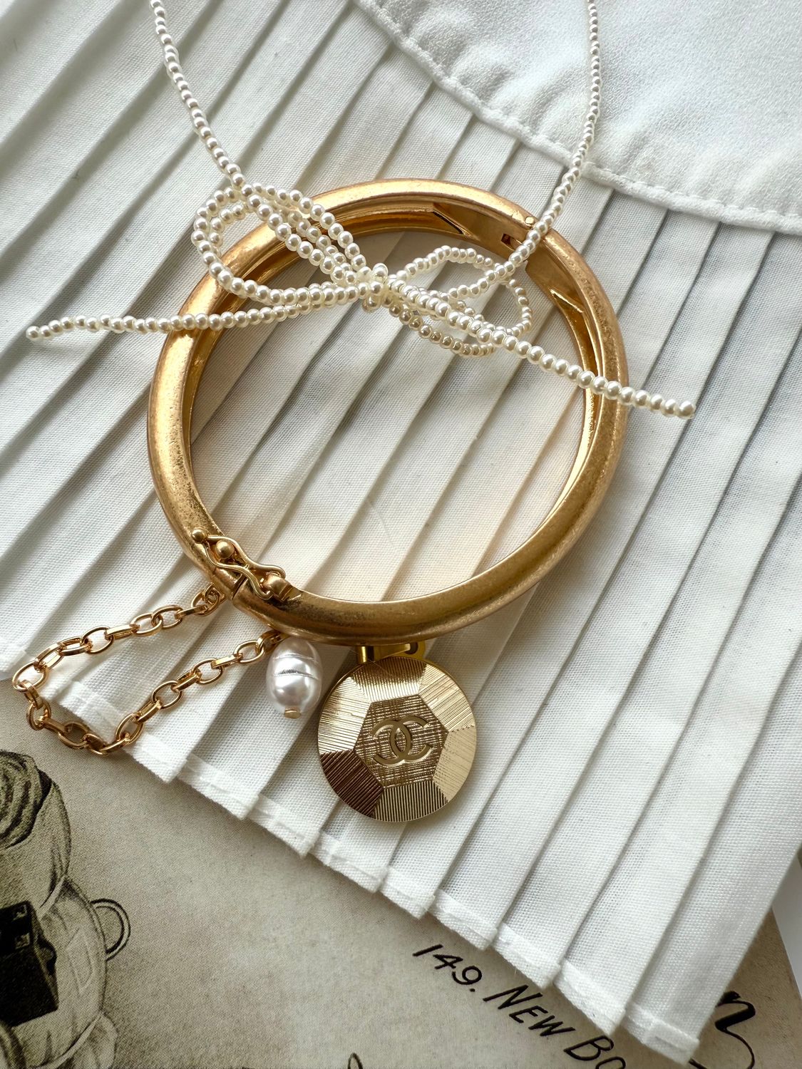 Delicate Gold tone charm bracelet