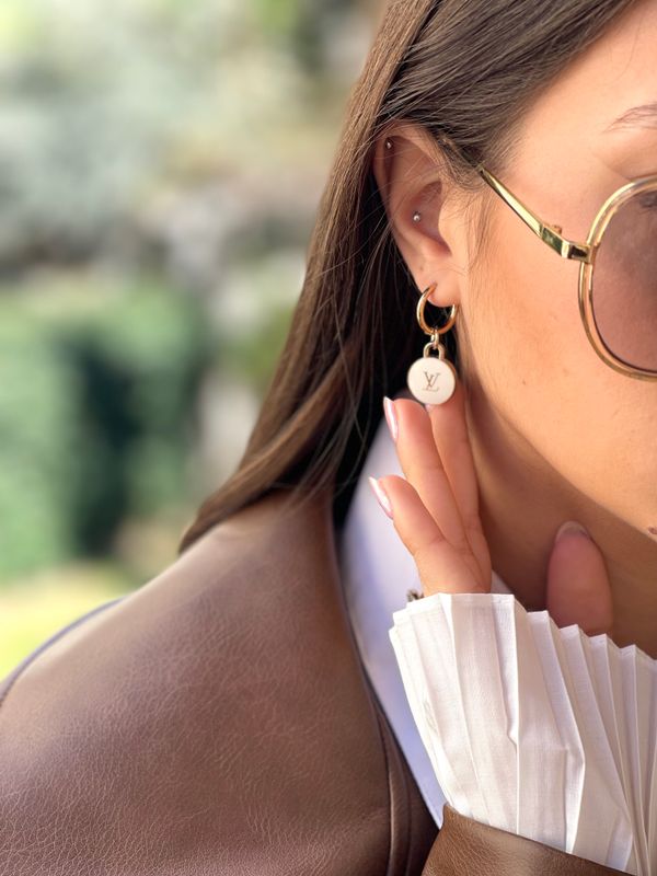 Stylish hoop earrings with small charm