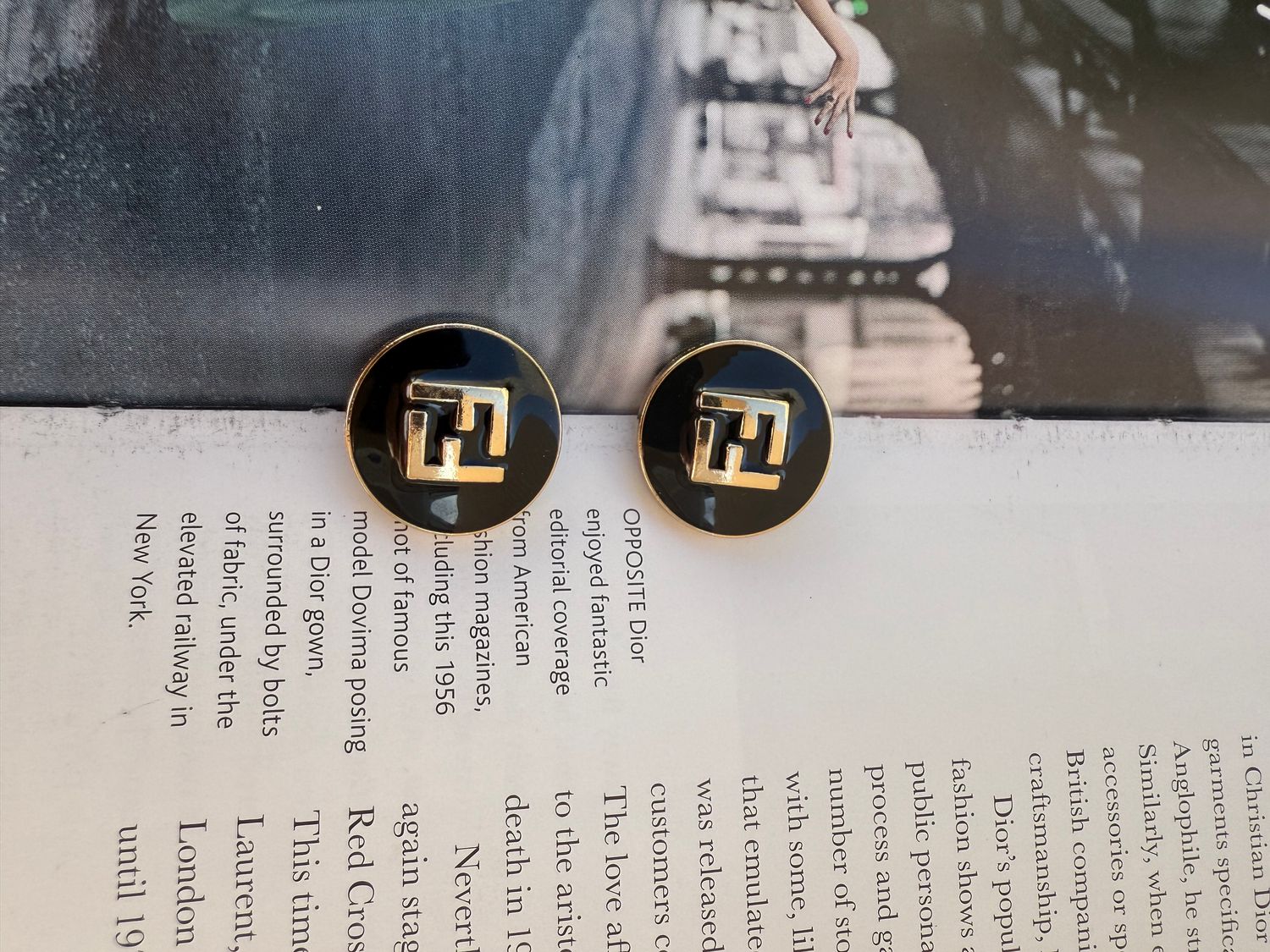 Stylish F black and gold tone earrings