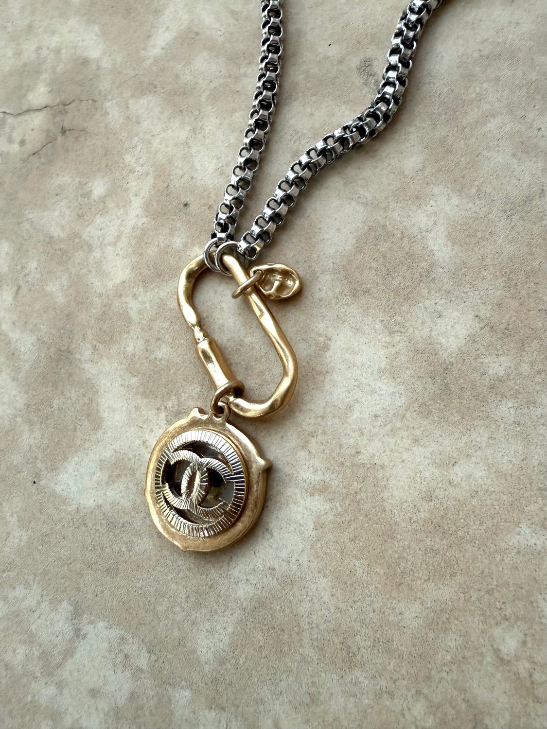Elegant silver and gold tone charm necklace