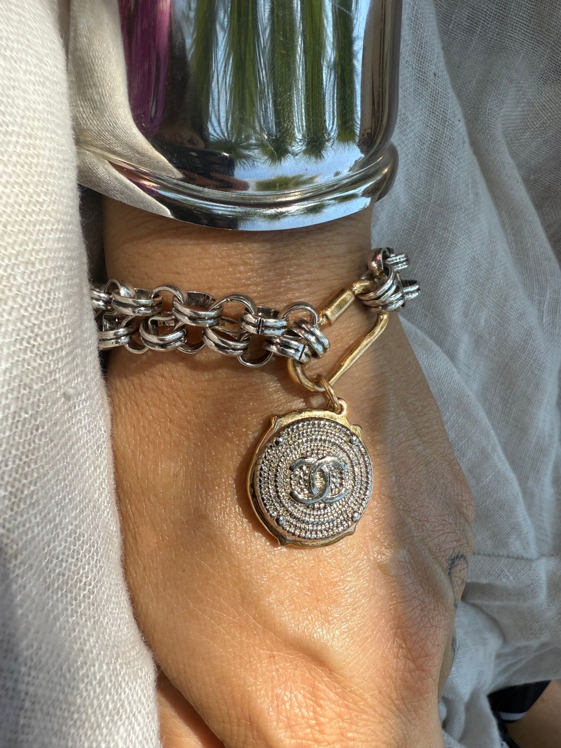 Classy silver tone with gold details charm bracelet