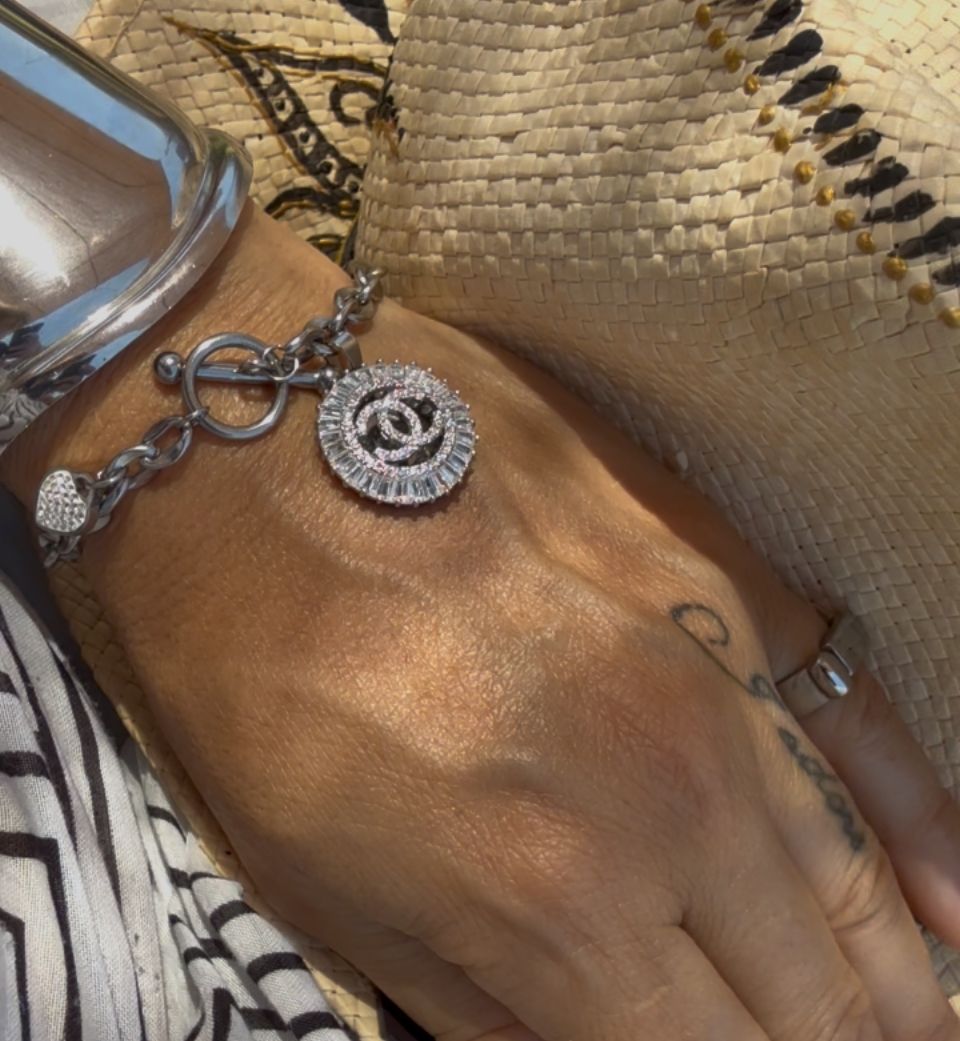 Elegant silver tone charm bracelet