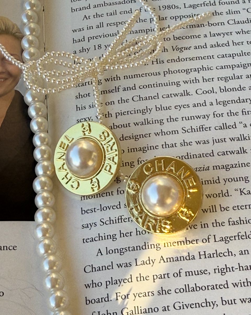 Delicate yellow gold tone earrings with pearl