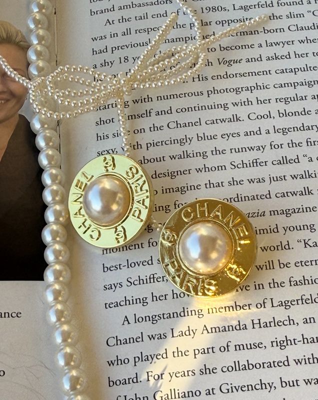 Delicate yellow gold tone earrings with pearl