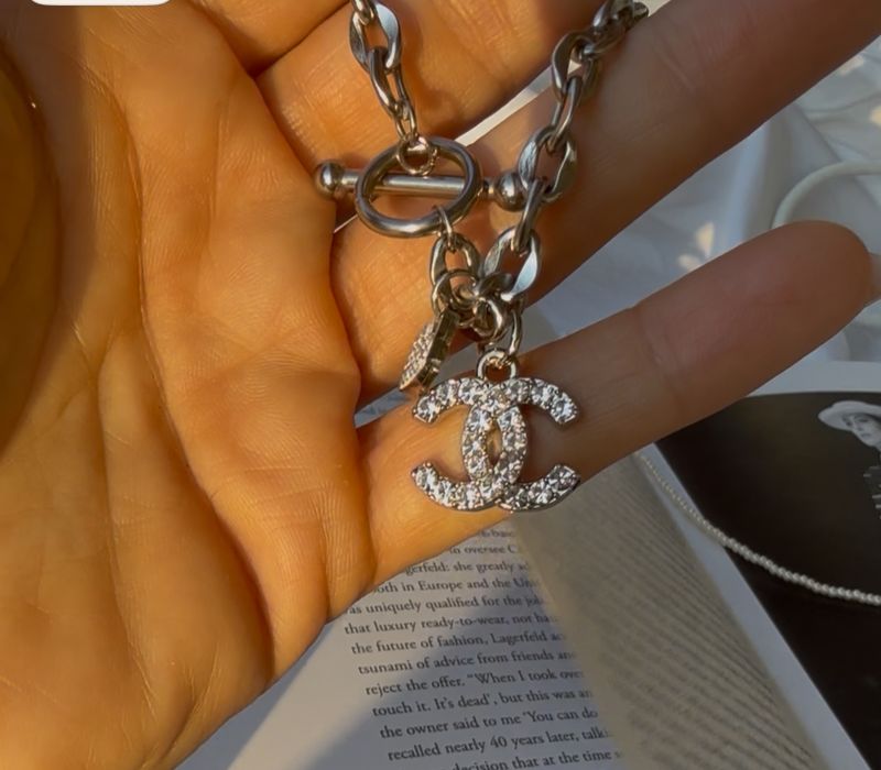 Delicate silver tone chain with charm bracelet