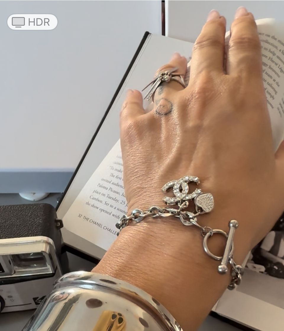 Delicate silver tone chain with charm bracelet