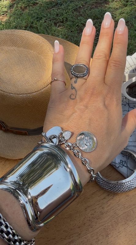 Silver tone bracelet with charm