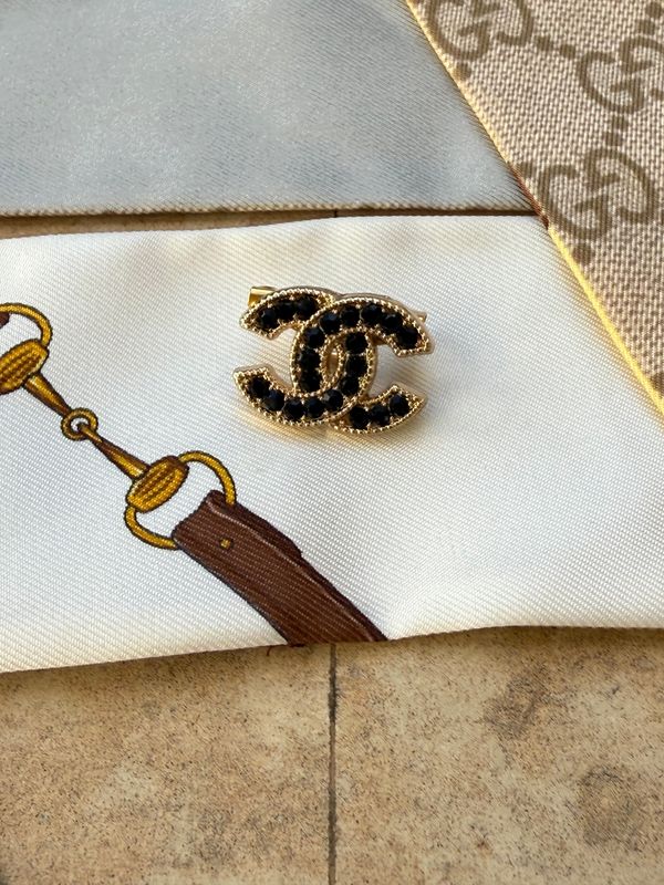 Black rhinestones logo reworked brooch