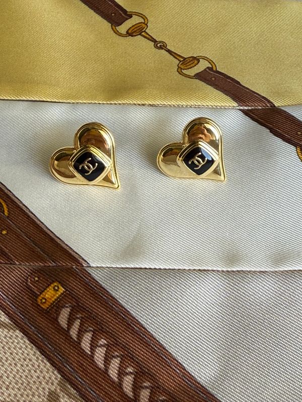 Delicate gold tone hearts with black logo