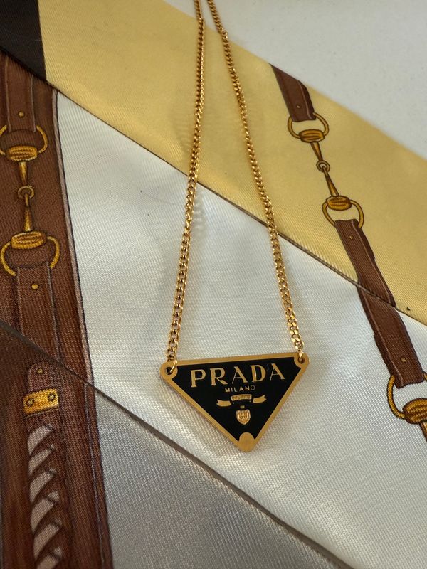 Stylish black and gold tone triangle necklace