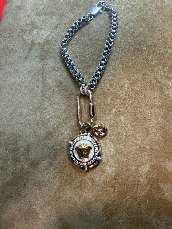 Stylish silver and gold tone Medusa bracelet