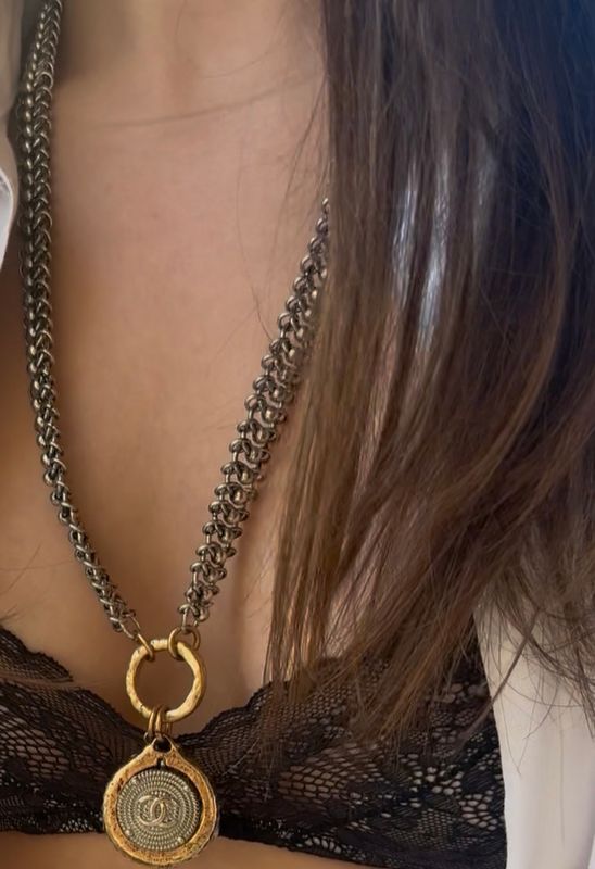Stylish silver tone necklace with gold tone pendant