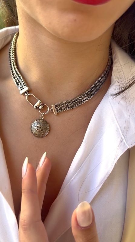 Stylish silver tone charm necklace