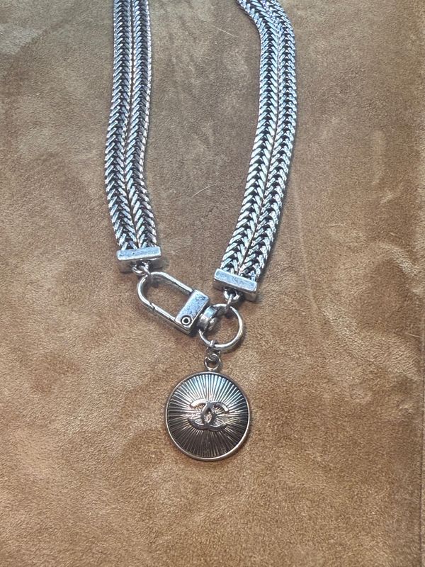 Stylish silver tone charm necklace