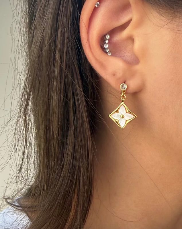 Delicate gold tone stud earrings