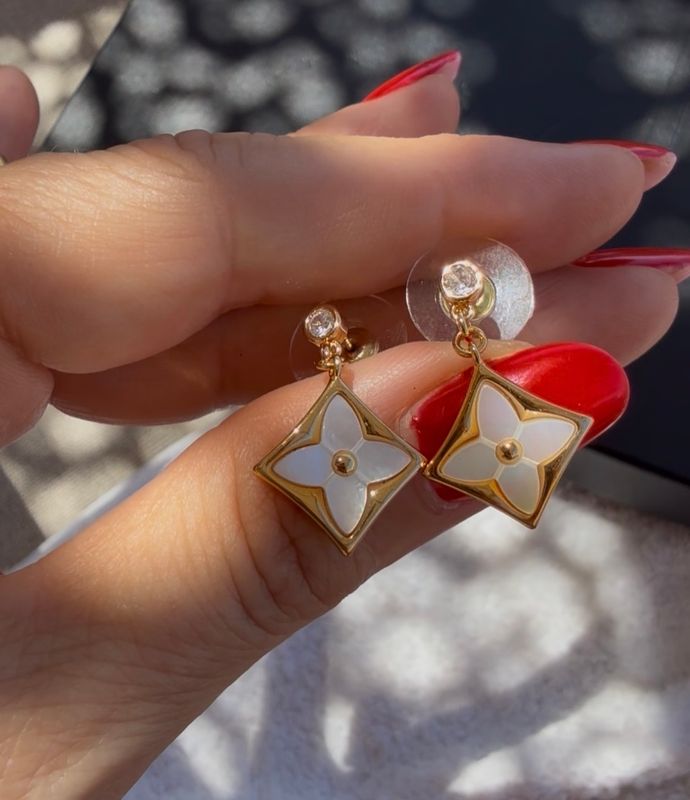 Delicate gold tone stud earrings